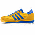 Adidas SL 72 amarelo mostaza bandas azul royal suela crema perfil izquierdo