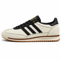 Adidas SL 72 RS crema pele bandas preto dourado suela borracha perfil izquierdo