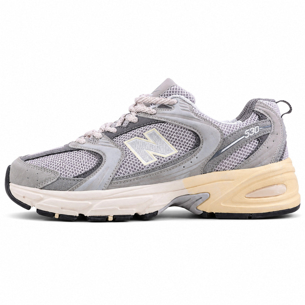 New Balance 530 cinzento crema ante vista lateral izquierda