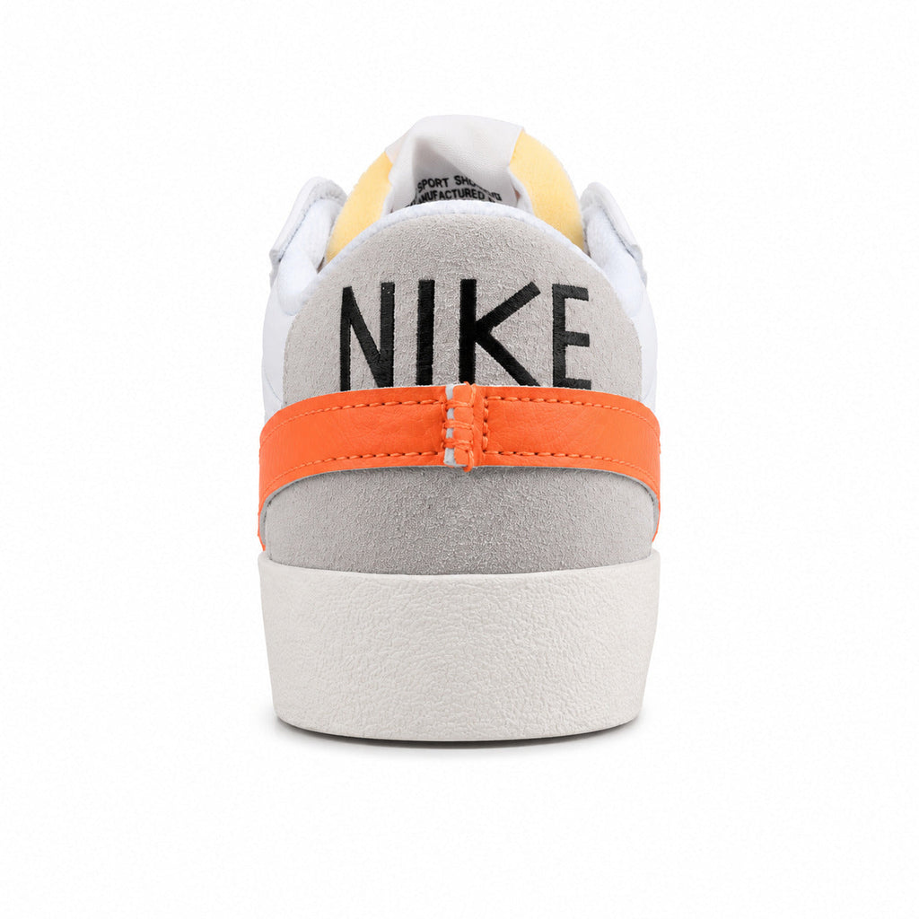 Nike Blazer Low 77 branco laranja vista trasera